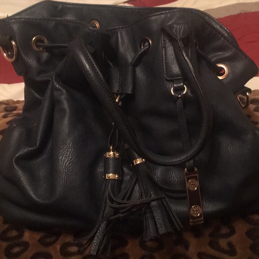 A dark blue arm bag